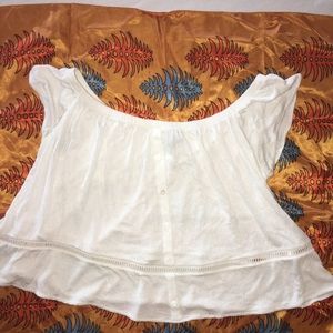 Off the should white top with detailed design